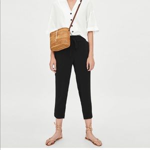 Pants with slit at hem